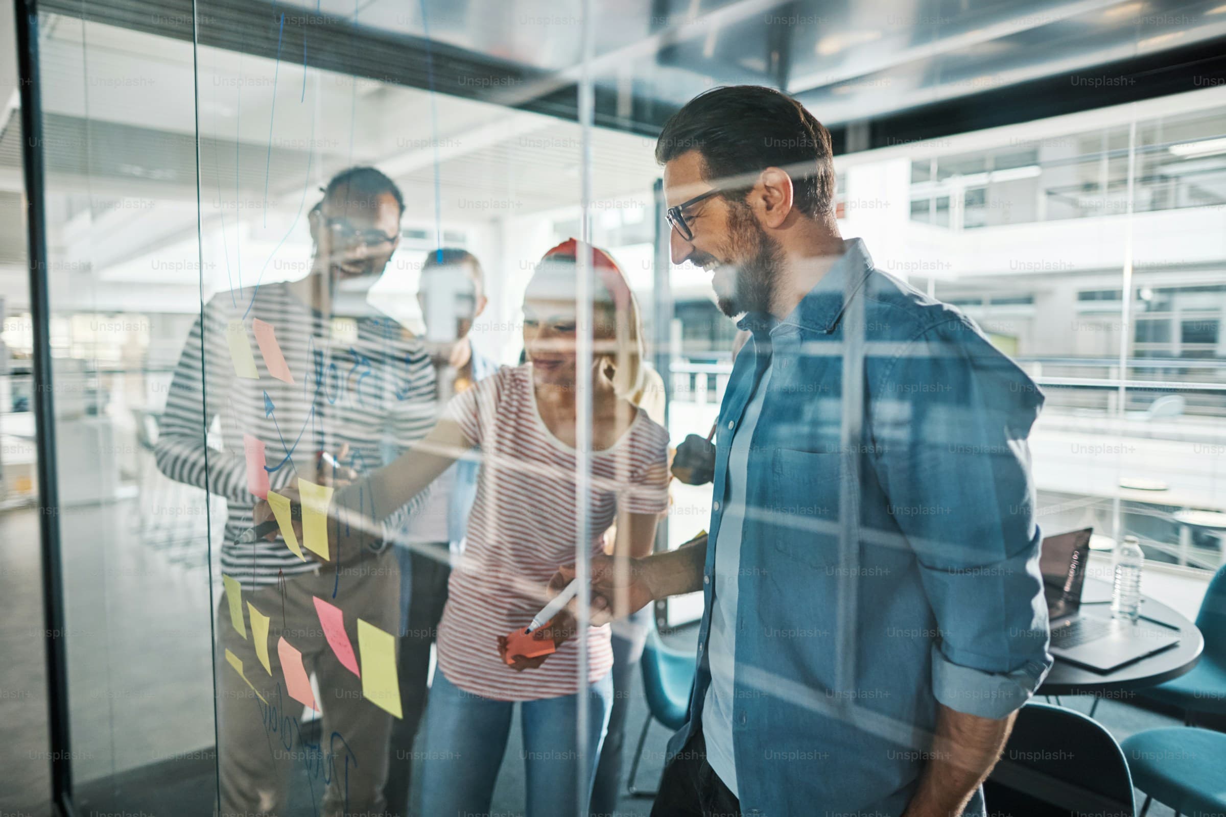 Diverse Sphere team collaborating in a modern South Florida workspace