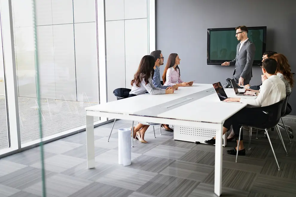 Cross-functional AI delivery team in a meeting