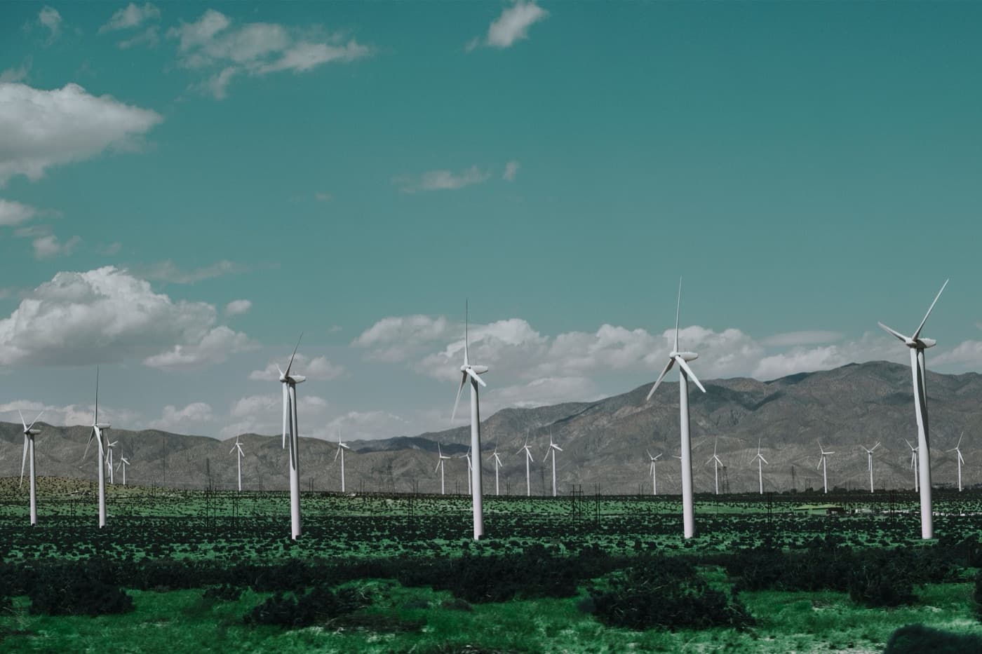 Wind turbines across a desert landscape