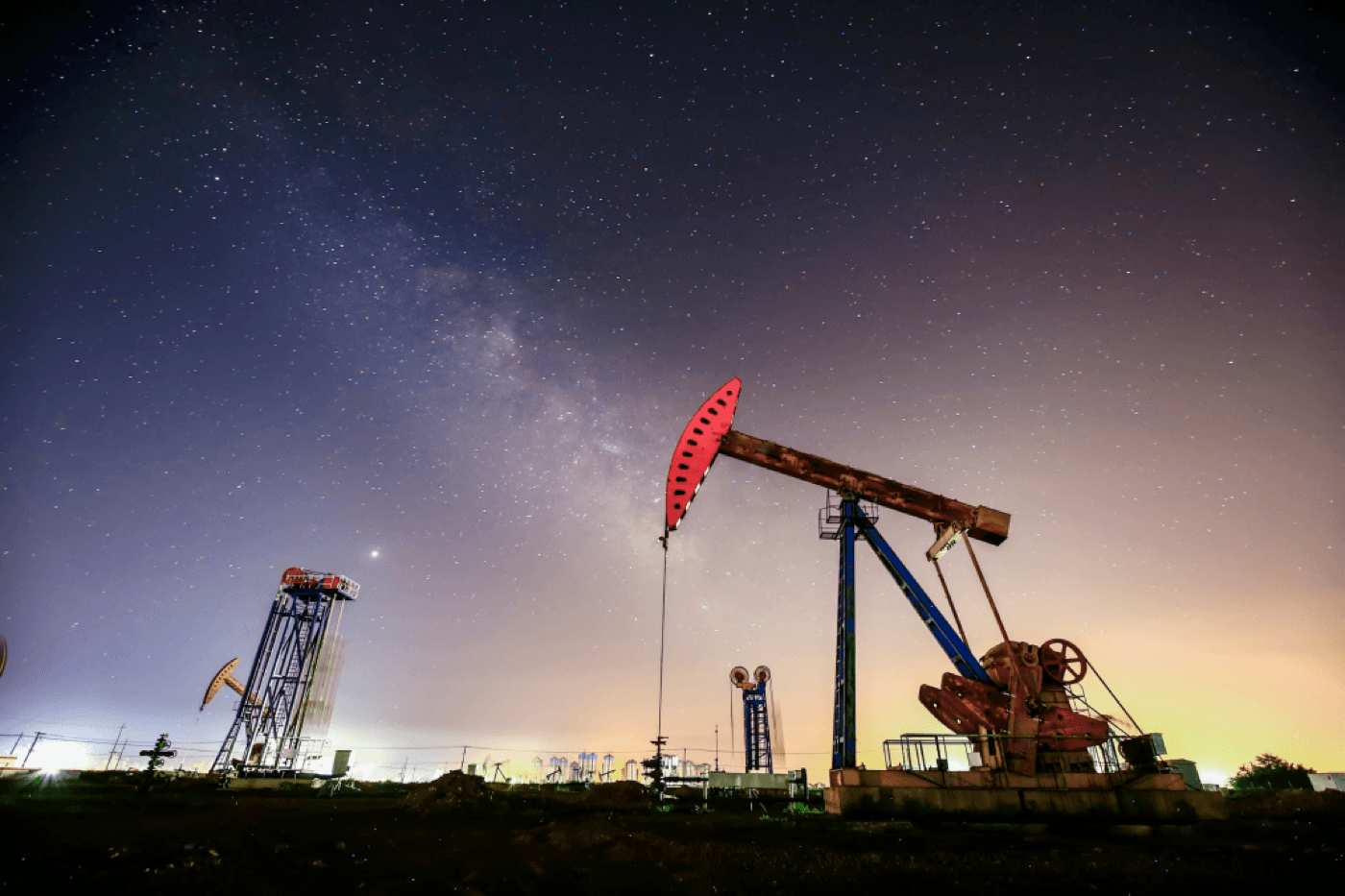 Oil pumpjack against a dusk sky